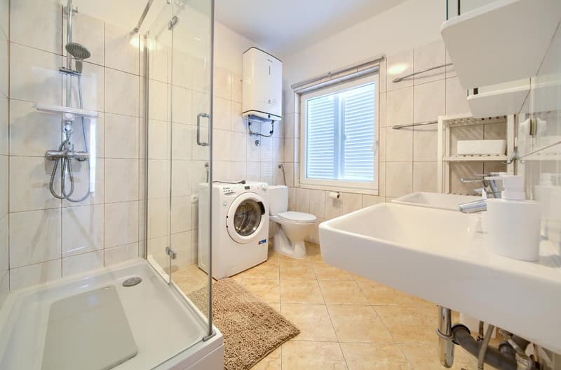 Bathroom with washing machine, large apartment